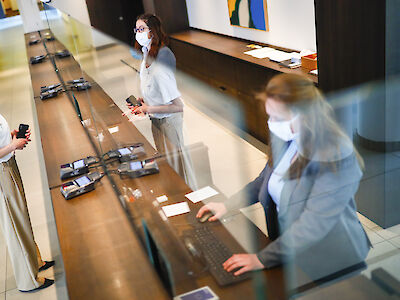 Women at a hotel reception desk